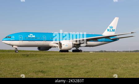 Boeing 777-300 (B773) of KLM Royal Dutch Airlines taxing for departure at Amsterdam Schiphol Airport. Stock Photo