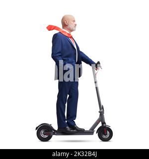 Corporate businessman riding a fast eco-friendly electric scooter, isolated on white background Stock Photo