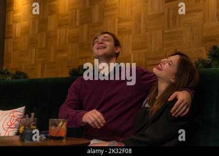 Amazing and adorable couple is hugging and laughing Stock Photo