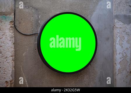 Round banner on the old concrete wall. Black circle signboard for logo Stock Photo