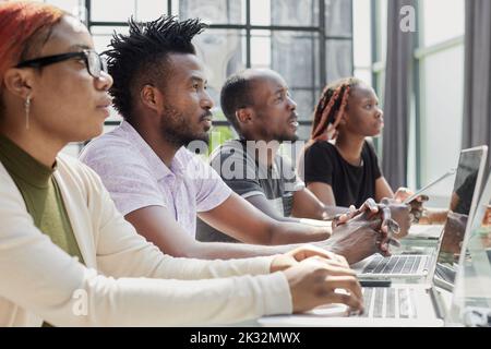 African american team working at call center office to help people with telemarketing assistance Stock Photo