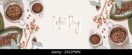 Coffee Day holiday banner with organic roasted coffee beans on a green leaves and coffee powder in a glass jar on an ivory background with shadows and Stock Photo