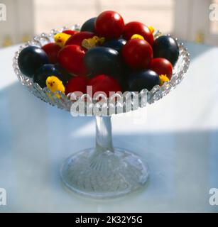 Red and Blue Dyed Eggs with Yellow Chicks for Easter Greek Tradition Stock Photo