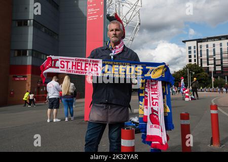 A street vendor sells merchandise for today’s 25th Betfred Super League Grand Final match St Helens vs Leeds Rhinos at Old Trafford, Manchester, United Kingdom, 23rd September 2022  (Photo by James Heaton/News Images) Stock Photo