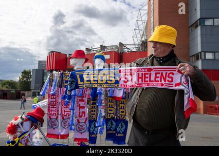 A street vendor sells merchandise for today’s 25th Betfred Super League Grand Final match St Helens vs Leeds Rhinos at Old Trafford, Manchester, United Kingdom, 23rd September 2022  (Photo by James Heaton/News Images) Stock Photo