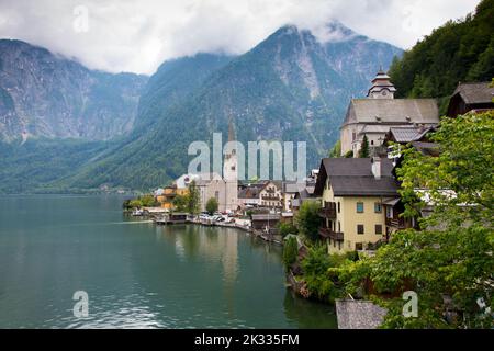 typical view of Hallstatt the world famous village town in upper Austria with two churches on Hallstätter lake Stock Photo