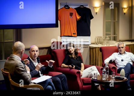 2022-09-24 15:34:29 ZEIST - Secretary-General Gijs de Jong (2L) of the KNVB, MEP Lara Wolters (2R) (PvdA) and Gerard Arink (R) during a debate about the World Cup in Qatar. One of the topics discussed is the exploitation of migrants during the construction of the stadiums. Last year fifty labor migrants died from various causes. More than 500 workers were injured. ANP KOEN VAN WEEL netherlands out - belgium out Stock Photo
