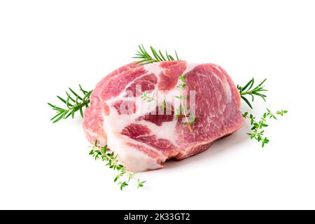 Pieces of pork meat with rosemary and thyme leaves on isolated on white background, raw fresh pork neck meat steaks concept Stock Photo