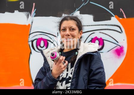 Birmingham, UK. 24th Sep, 2022. An artist of the 'RestingB Face' group, one of about a dozen women street graffiti artists working on walls in Digbeth as part of the High Vis Street Art Festival at the Tea Works. Street art of this kind is often seen as a male dominated culture, but this is changing. Credit: Peter Lopeman/Alamy Live News Stock Photo