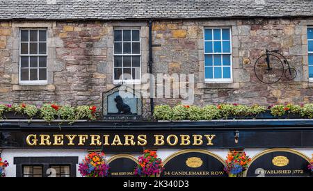 Exterior view of Greyfriar's Bobby old pub with silhouette of dog pub sign, Edinburgh, Scotland, UK Stock Photo