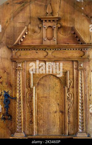 Wooden gate with carvings, Church of St. Anna in Betzigau, Allgaeu, Bavaria, Germany Stock Photo