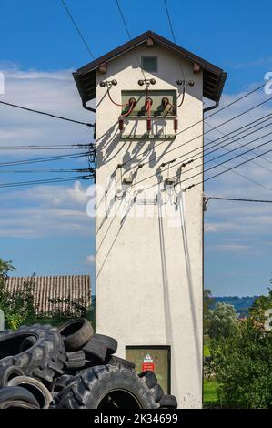 Transformer station, transformer tower and old tyres, Niedersonthofen, Allgaeu, Bavaria, Germany Stock Photo