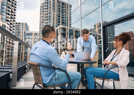 Multiethnic team of corporate workers participating in brainstorming session Stock Photo