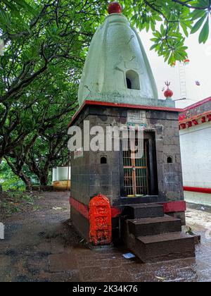 Kolhapur,India- July 19th 2021; Stock photo of an old hindu temple made up of gray stones,roof top of the temple painted by white color.Picture captur Stock Photo