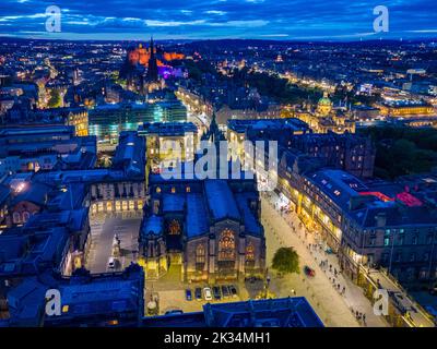 Edinburgh, Scotland, UK. 24th September 2022. Aerial view at night of the Royal Mile two weeks after Queen Elizabeth II lay inside St Giles Cathedral and thousands of people lined the street. The Royal Mile is now back to normal and still busy with the usual heavy influx of tourists.  Iain Masterton/Alamy Live News Stock Photo