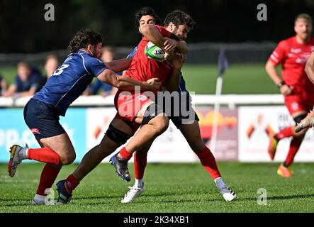 Richmond, United Kingdom. 24th Sep, 2022. Championship Rugby. London Scottish V Jersey Reds. The Richmond Athletic Ground. Richmond. Lewis Wynne (Jersey Reds, captain) is tackled by Luca Petrozzi (London Scottish) and Zach Clow (London Scottish, 23) during the London Scottish V Jersey Reds championship rugby match. Credit: Sport In Pictures/Alamy Live News Stock Photo