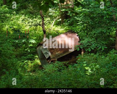 A large rusty metal in the woods at Big Bull Creek Park in Edgerton Kansas Stock Photo