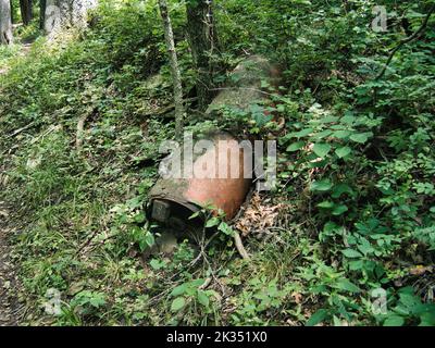 A large rusty metal in the woods at Big Bull Creek Park in Edgerton Kansas Stock Photo