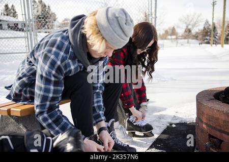 Two teen girl friends goofing off on an outdoor ice rink in Southern  California Stock Photo - Alamy