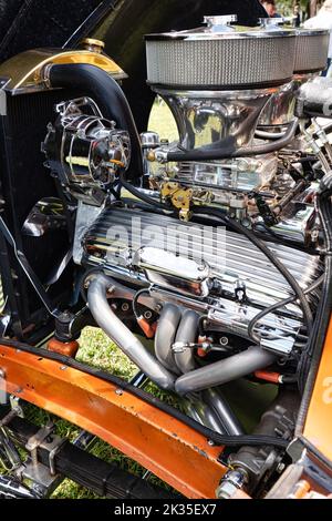 Hotrod Engine with dual carburetors, headers and lots of shiny chrome. Stock Photo