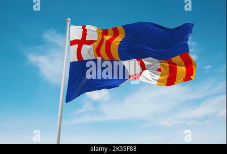 official flag of Barceloneta, Puerto Rico untied states of America at cloudy sky background on sunset, panoramic view. USA travel and patriot concept. Stock Photo