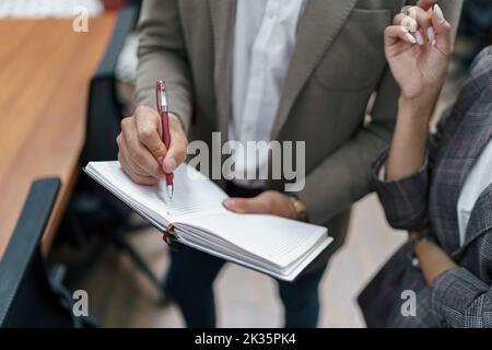 Close up of Businessman standing in office and making notes  Stock Photo
