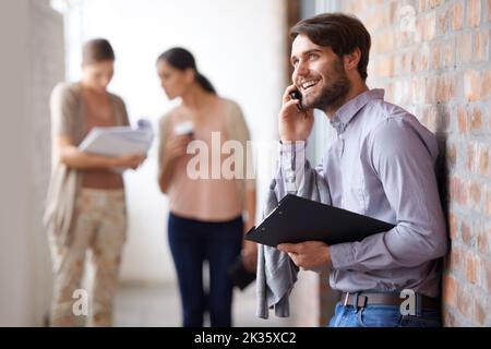The number one team in the business. three young colleagues in their office building. Stock Photo