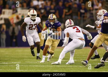 Washington running back Wayne Taulapapa celebrates after scoring a ...