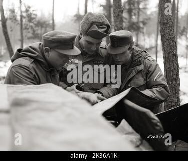 Midway During Maneuver Reconnaissance Mission, 32nd Armor Scout, Sgt Elvis Presley, Coordinates with German Bundeswehr Soldiers on Location and Direction to Move Stock Photo