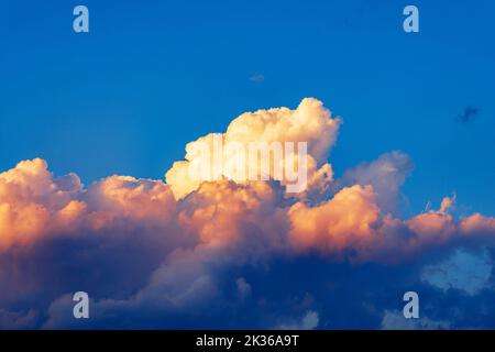 Photography of beautiful storm clouds, cumulus clouds or cumulonimbus at sunset. Full frame, sky only. Stock Photo