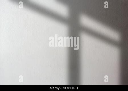Black shadows on concrete wall. Shadow overlay effect. Scene of natural lighting. Blank background for design. Background for ideas. Stock Photo