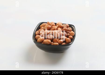 Big peanut set isolated on white background. Groundnuts shelled and in nutshell. Package design. Stock Photo