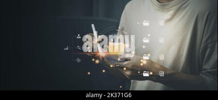 Cloud computing technology concept. Man hold tablet and smart pen using bigdata. Internet storage network system.  Business and finance. Stock Photo