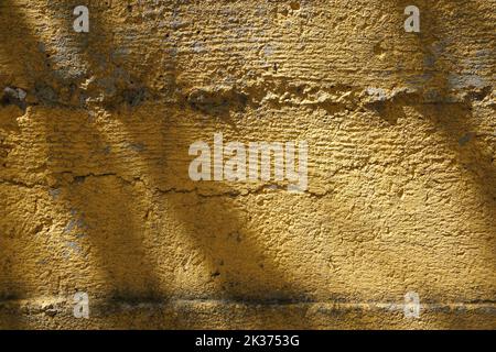 yellow plastered old wall floor, background Stock Photo