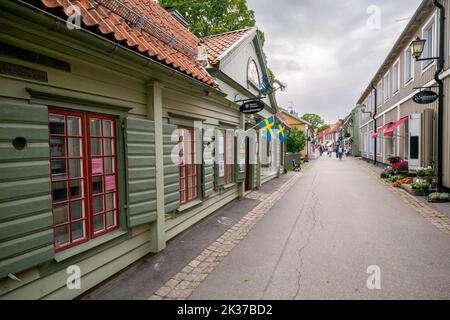 Sigtuna, Sweden - 09.02.2022: Stora Gatan, main historical street of Sigtuna, oldest town in Sweden. Cloudy day of summer. Stock Photo