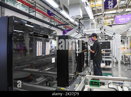 (220925) -- CHONGQING, Sept. 25, 2022 (Xinhua) -- A worker is seen at the production line of a dishwasher interconnected factory of Chongqing Haier Washing Electric Appliances Co.LTD in southwest China's Chongqing, Sept. 25, 2022. A dishwasher interconnected factory of Chongqing Haier Washing Electric Appliances Co.LTD was officially put into production here at Gangcheng Industry Park in Jiangbei District of Chongqing on Sunday. This 42,000-square-meter factory, with a designed annual output of one million dishwashers, will utilize advanced technologies like 5G and Industrial Internet towards Stock Photo