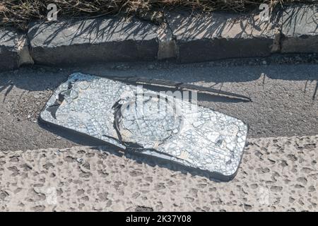 Broken truck side mirror on the street. Stock Photo