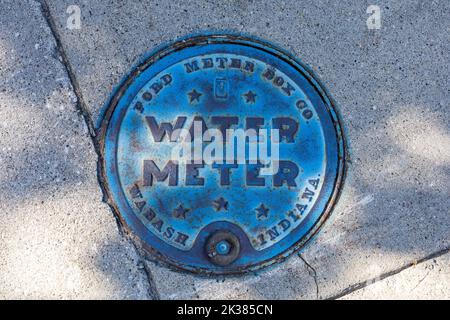 Ford Meter Box Co Water Meter Cover On A Pavement In Frankenmuth Michigan America, Side Walk Utility Cover Stock Photo