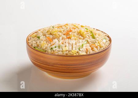 homemade fried rice with mixed vegetable (carrot, green bean peas, corn) and egg Stock Photo