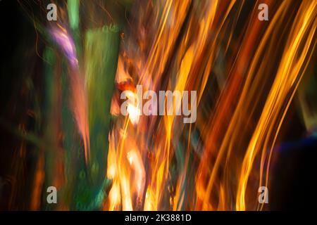 Abstract background of blurred stripes from salute and fireworks. Light multicolored effects. Stock Photo