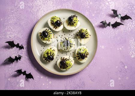 Deviled eggs with a Spider for Halloween Stock Photo
