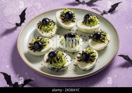 Deviled eggs with a Spider for Halloween Stock Photo