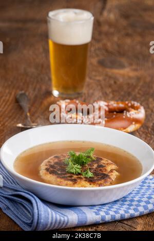 austrian cheese dumpling soup on wood Stock Photo