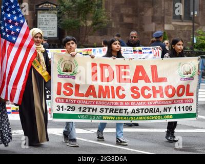 New York City, United States. 25th Sep, 2022. Participants are seen  holding a banner of Ideal Islamic School during the annual Muslim Day Parade along Madison Avenue in New York City. Credit: Ryan Rahman/Alamy Live News Stock Photo