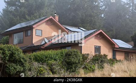 Solar panels installed & operating on residence roof. Stock Photo