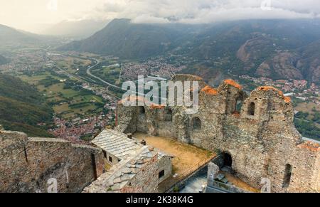 Ruins in the complex of the Sacra di San Michele abbey overlooking the Susa valley landscape near Turin, Italy Stock Photo