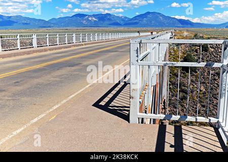 Approximately 600 feet over the Rio Grande, the steel deck arch bridge with pedestrian viewpoints on both sides near Taos, New Mexico. Stock Photo