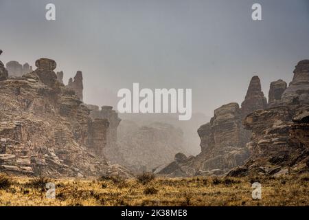 Snow Falls Over The Rock Formations At The Beginning Of Cyclone Canyon in Canyonlands National Park Stock Photo