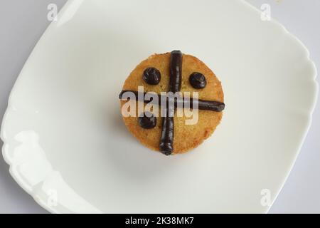 muffins baked with fresh blueberries on a white cake stand with fresh mint on top on a white wooden background Stock Photo