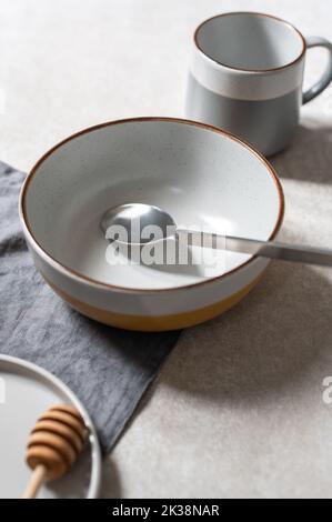 Empty plates on grey background Stock Photo